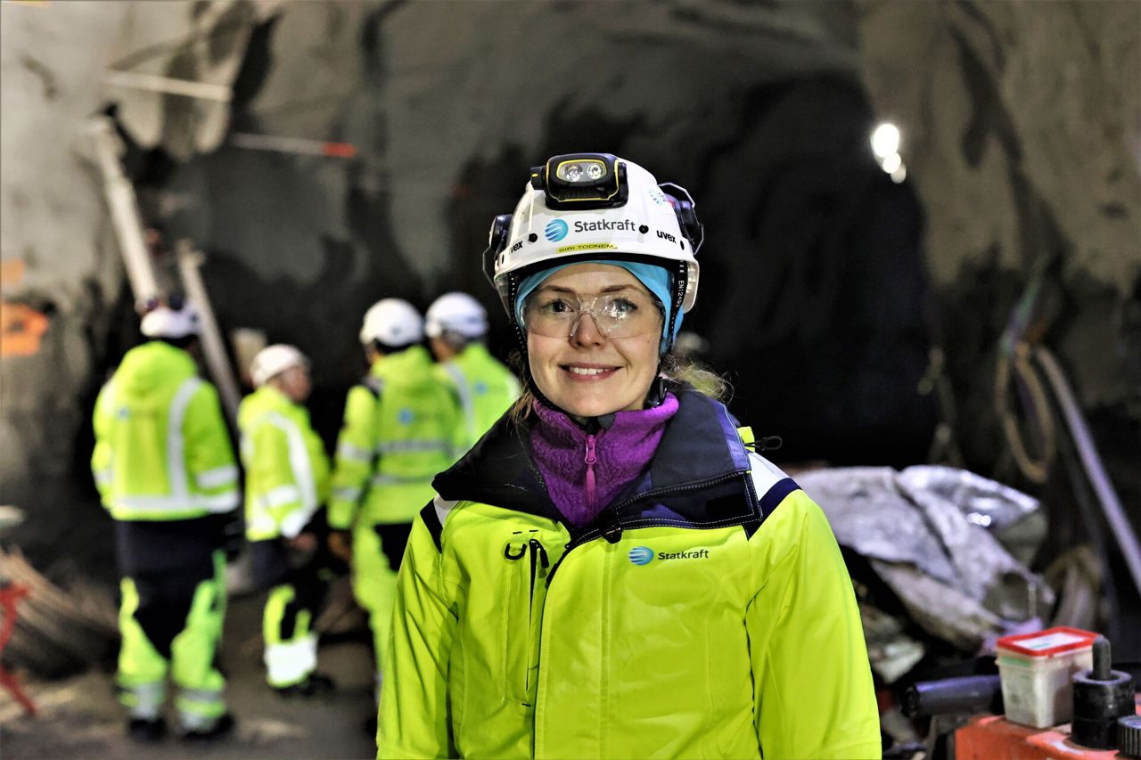 Woman wearing safety gear and smiling 